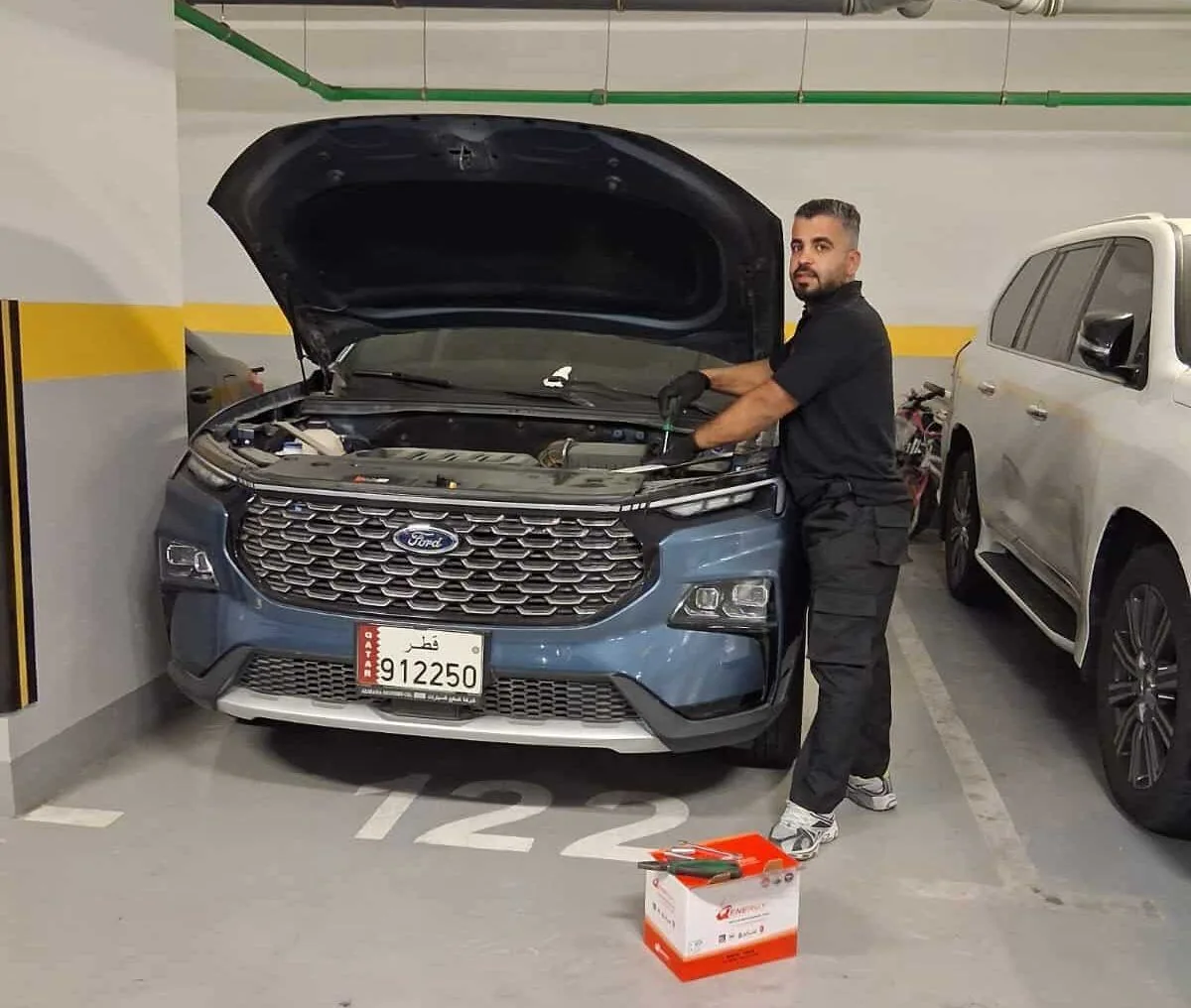 Mobile Car Battery Qatar technician performing Battery Voltage on-site