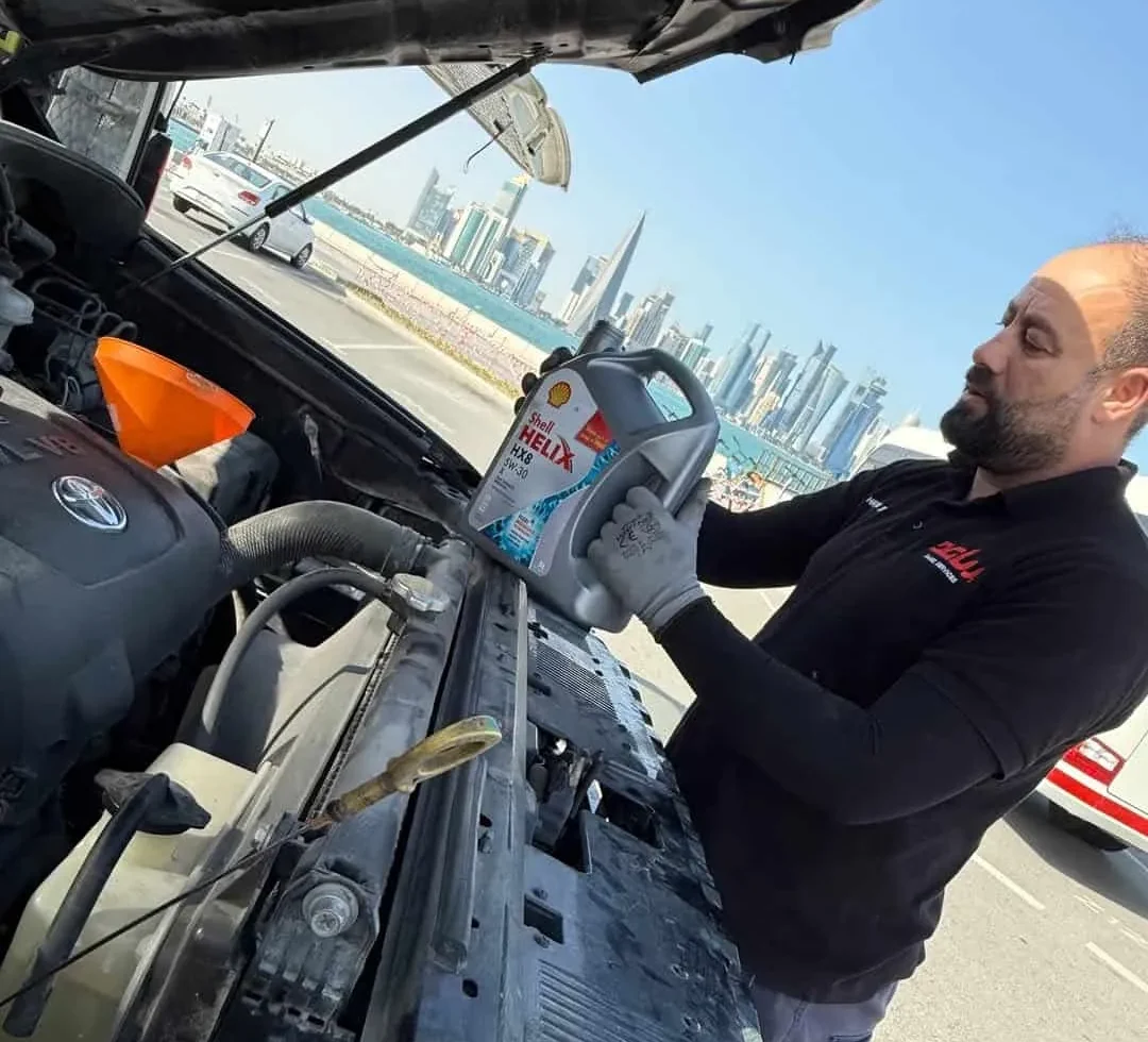 Mobile Car Battery Qatar technician performing Phoenix Battery on-site