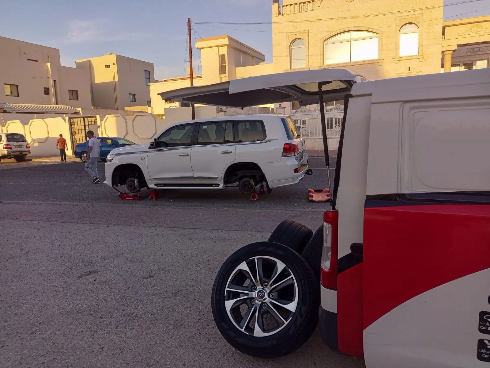 Mobile Car Battery Qatar technician performing Mobile Auto Battery Replacement on-site